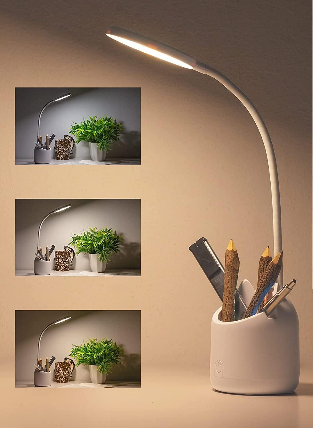 White desk lamp with flexible neck on a beige background