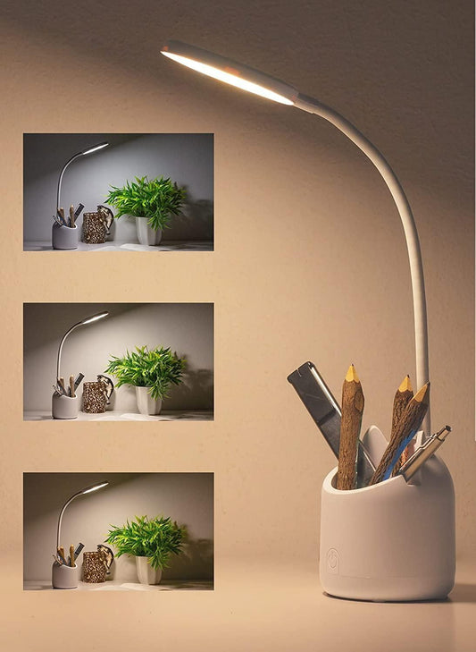 White desk lamp with flexible neck on a beige background